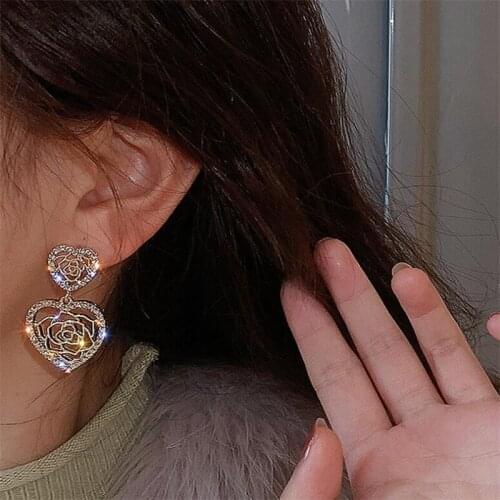 European and European fashion fashion inlaid earpins Korean version of love hollow-out flower earrings pendant simple retro fash