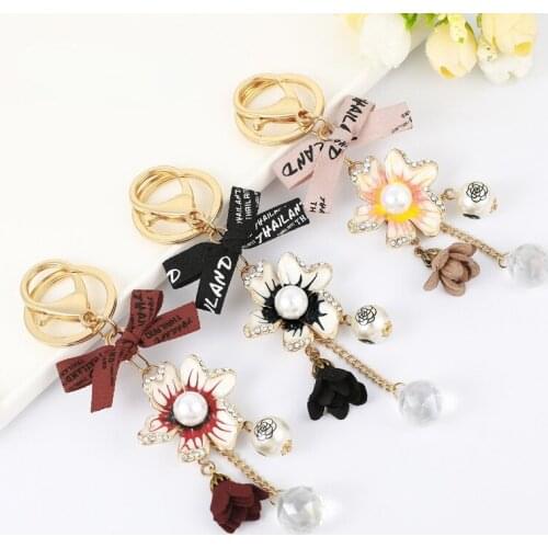 2021 Fashion Creative New Drip Oil Pearl Camellia Keychain Bowknot Flower Pendant Girl Bag Small Jewelry Gift