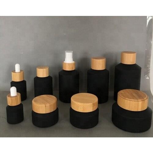 60ML 100ml black matte glass cream jar lotion spray pump bottle with luxury bamboo lid wood cap Cosmetic container face mask jar