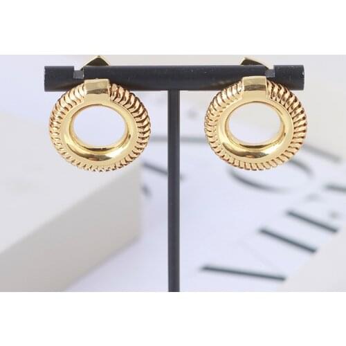 Simple metallic texture cold wind European and American hollow doughnut minimalist fashion earring earring girls