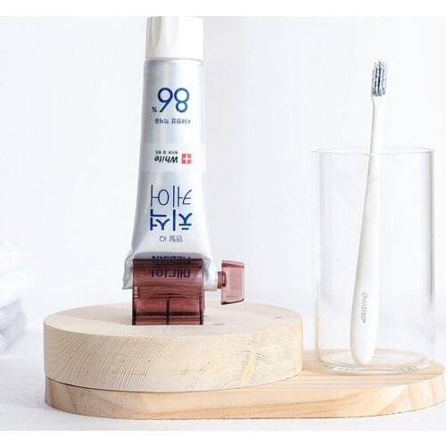 1Pc 4 Colors Home Plastic Toothpaste Tube Squeezer Dispenser Rolling Holder Bathroom Supply Tooth Lazy Vertical Manual Rotation