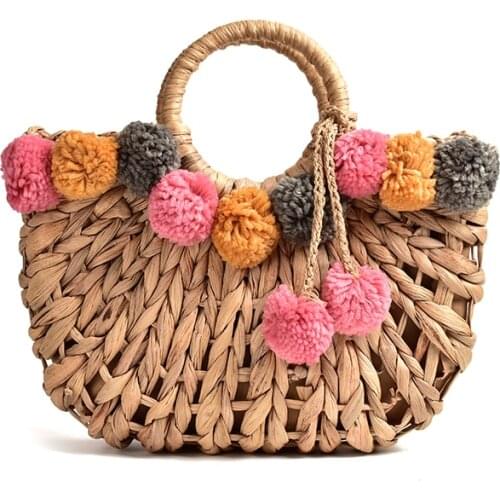 2021 New Fashion Hollow Straw Bag Temperament Color Hair Ball Hand-woven Bag Female Shoulder Portable Beach Bag