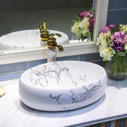 China Artistic Handmade Ceramic wash basin Round Counter top bathroom oval white ceramic wash basin bathroom sink