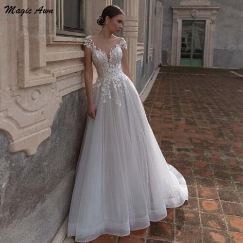 Magic Awn Graceful Princess Wedding Dresses 2021 Lace Appliques Backless Illusion A-Line Short Sleeve Vintage Bridal Gowns Robes