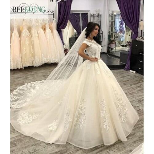 Luxurious Ivory Organza Lace Beading Cap Sleeves Floor-length Ball Gown Wedding Dress Chapel Train Custom Made