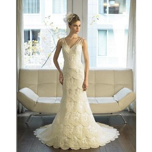 Mermaid features layers of corded embroidered lace illusion sleeves deep v-back train bridal gown dress wedding