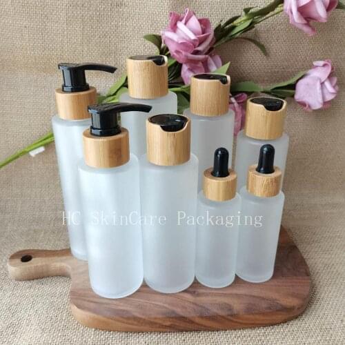 Wholesale Empty Cosmetic Lotion Frosted Glass Bottle Bamboo Pump lid Facial Care Container Packaging Bottles Body Lotion Bottles