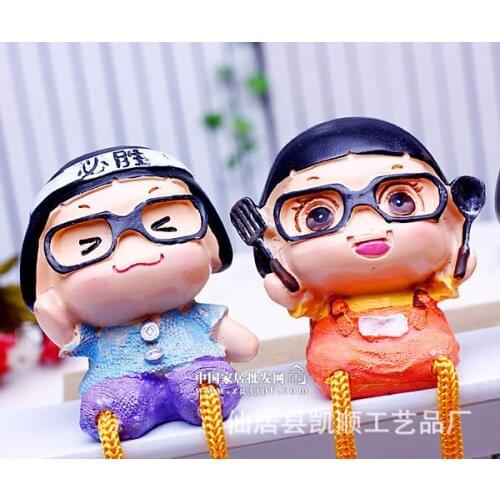 Spot wholesale and retail single painted resin doll hanging feet Cai Cai trumpet SZ-34032