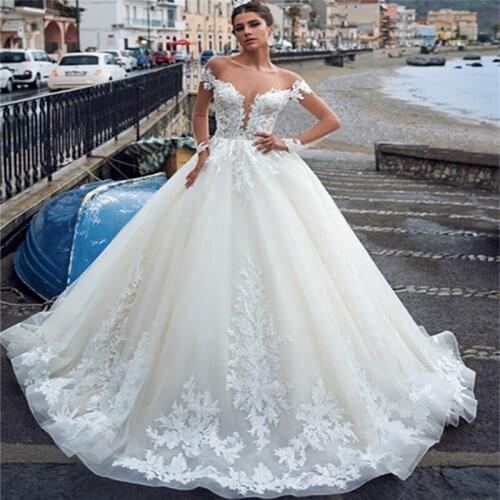 Elegant Long Sleeve See Through Back Wedding Dresses Ball Gown Spain Lace Bridal Gowns