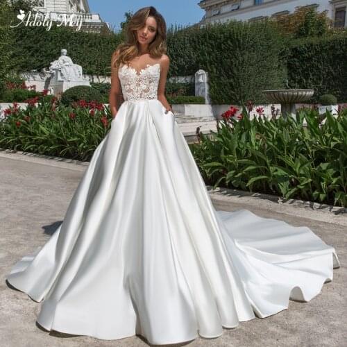 Adoly Mey New Arrival Scoop Neck Backless A-Line Wedding Dresses 2020 Luxury Appliques Beaded Chapel Train Princess Bride Gown