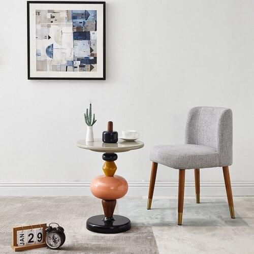 Artistical and creativity minimalist end table shuffle colored candied fruit side table a few piles of wood home decoration