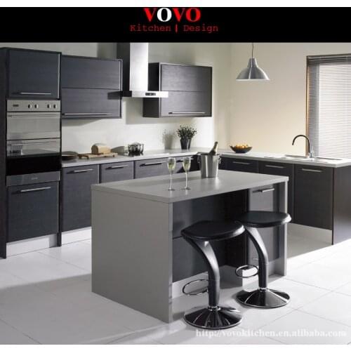 Matte grey lacquer kitchen cabinet with an extended island for breakfast