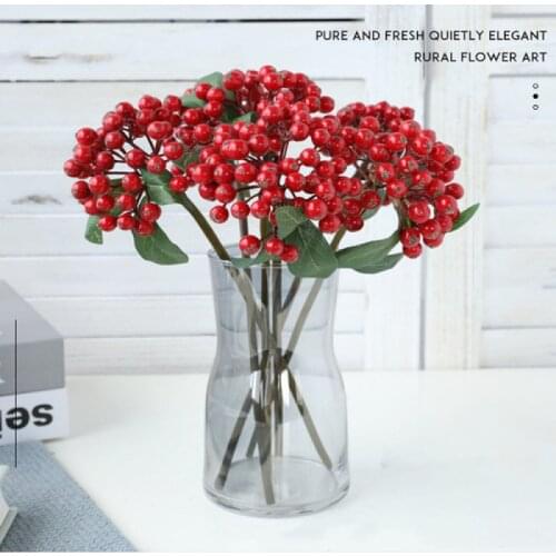 Imitation of berry berry bunche branches, ferro fruit, caramel, decorated floral arrangement with Christmas berry accessories