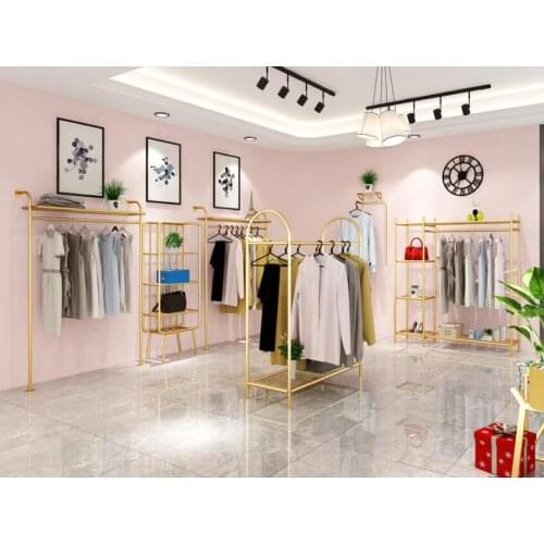 Wall hanging clothes rack on display shelf of clothing store