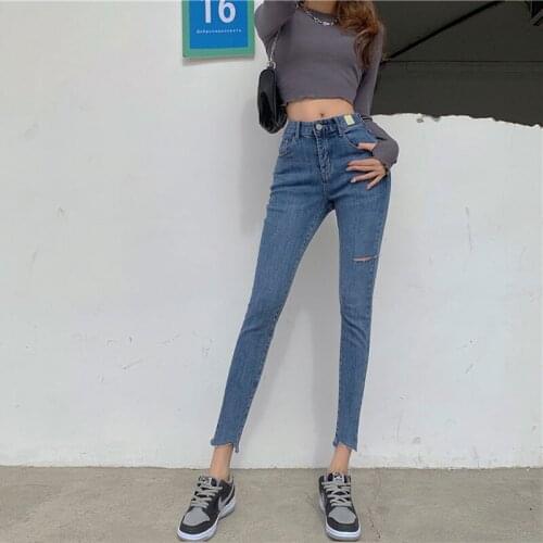 Spot Chinese new womens pants personality fashion trend blue hole high waist tight stretch jeans small foot pants