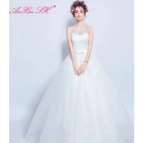 AXJFU Sexy Flower white lace wedding dress Princess vintage Brides sleeveless perspective illusion bow wedding dress 612
