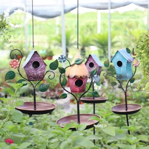Decorative colorful rustic vintage metal birdhouse bird feeder