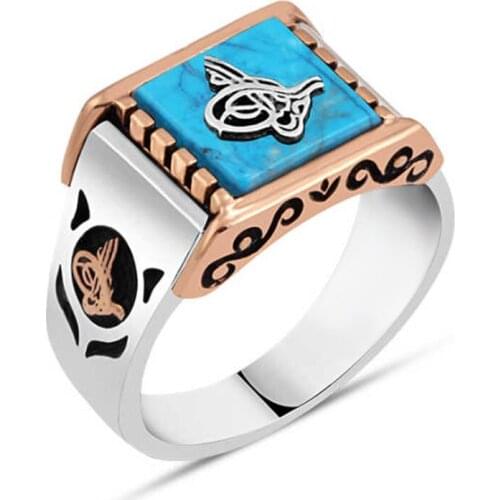 Squeezing Turquoise Gemstone Above Monogram Sterling Silver Men 'S Ring