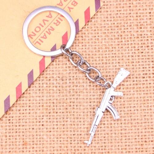 20pcs New Fashion Keychain 44*15 mm machine gun assault rifle ak-47 Pendants DIY Men Jewelry Car Key Chain Souvenir For Gift