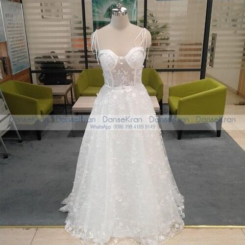 2021 Ivory Wedding Dresses with Pockets Spaghetti Straps Lace Appliques Bride Dresses A-Line Floor Length Bridal Gowns for Women