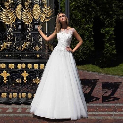 2021 Spring Graceful A Line White Lace Top Bridal Wedding Gowns Cap Sleeves Illusion Bateau Neck Bride Wedding Dresses Appliqued
