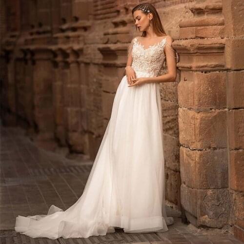 Elegant A-Line Tulle Wedding Dress 2021 Sheer O-Neck Tassel Lace Appliques Sweep Train Sleeveless Bridal Gown With Button Back