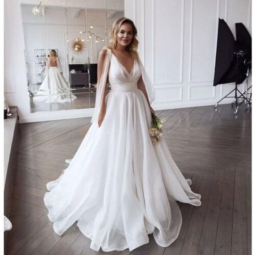 YIWUMENSA Deep V Neck Organza Boho Wedding Dress Puffy Tulle Sexy Backless Women Beach Bridal Gowns Cheap Robe De Mariee 2021