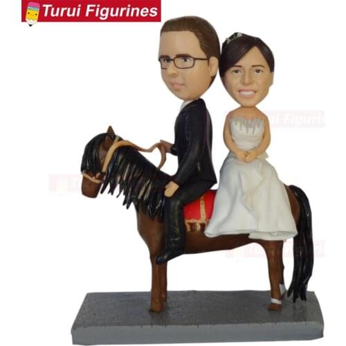 Turn your selfies into bobblehead couple riding hose wedding cake topper custom bobblehead mr&mrs wedding cake top clay dolls