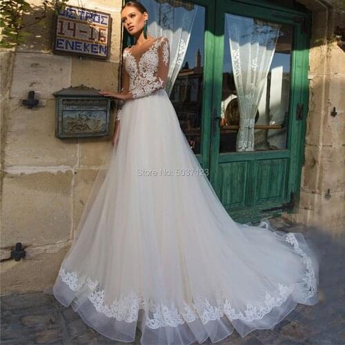 2021 Light Champagne Beach Wedding Dresses Lace Appliques Tulle Long Sleeve See Through Bridal Wedding Gowns Robe de Mariee