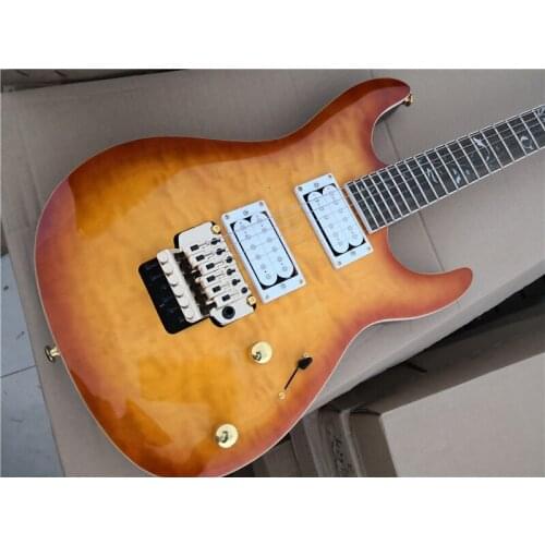 Free shipping custom 6 string cherry sunburst guitar,HH pickups,tremolo bridge,quilted maple veneer,flower inlay,gold buttons