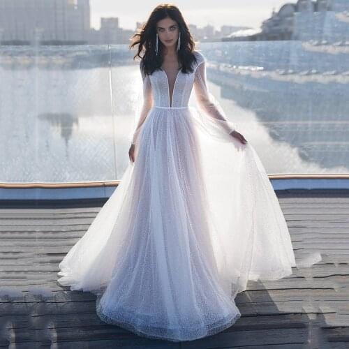 UZN Ivory A Line Floor Length Glitter Tulle Wedding Dress V Neck Long Puffy Sleeves Bridal Gowns With Beading Belt