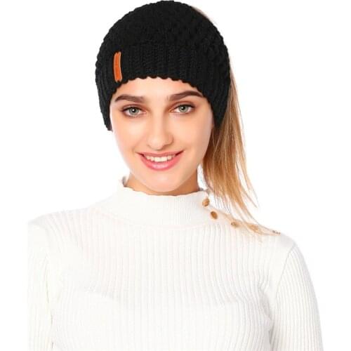 DUOJIAOYAN Eur-America New Knitted Hat Winter Women Ponytail Hat Ear Protection Wool Knitted Cap Empty Top Girls Hat
