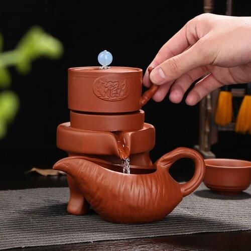 The new stone stone retro semi-automatic tea to run anti-hot and convenient automatic tea gift
