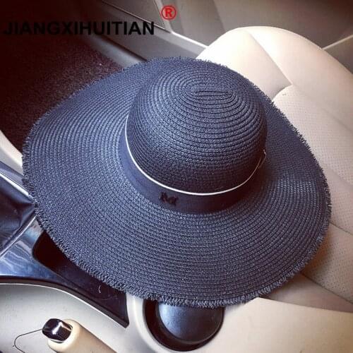 2018 new Hepburn Wind Black White Striped Bowknot Summer M logo Sun Hat Beautiful Women Straw Beach Hat Large Brimmed Hat