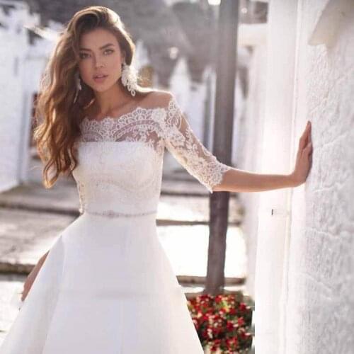 Simple A-Line Soft Satin Wedding Dresses Boat Neck Long Sleeve Sexy Open Back Pleats Ribbons Sashes Chapel Train Bride Gowns