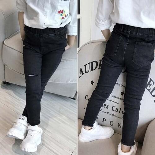 Girls personality hole jeans 2020 spring and autumn childrens clothing wild feet pencil pants childrens jeans