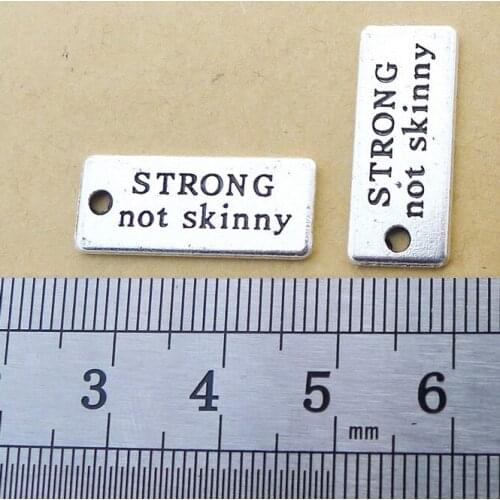50pcs Wholesale Sports Message Charm "STRONG not skinny " Antique Silver Tone 10*22mm