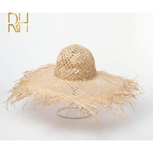 Summer new handmade hollow crochet raffia straw hat female fashion Fluffy round top Wide Brim natural grass cap beach hat Gift