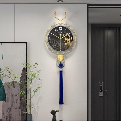 Living room wall clock home fashion simple art metal creative long tassel clock wall new Chinese clock