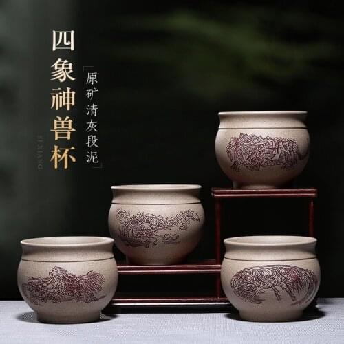 Purple sand tea set yixing teapot all hand four god beast like kung fu masters cup cup) accessories fair mug