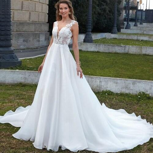 2021 Summer Beach Wedding Dresses White V Neck Sleeveless Appliques Backless Bridal Gowns Vestidos De Fiesta