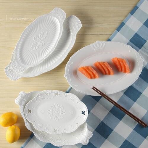 White embossed porcelain oval fish plate, ceramic pasta borden, serving tray, plate dessert kitchen, palace restaurant serving
