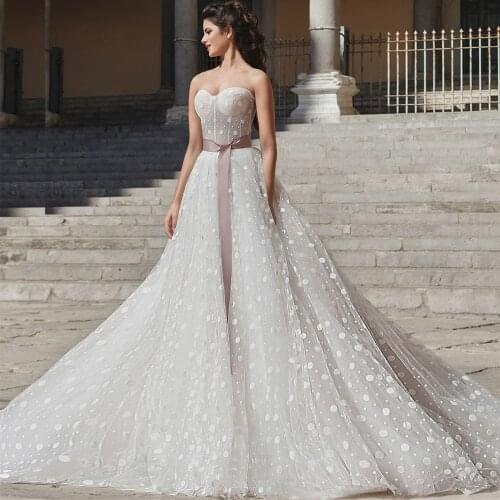 New Hot Sale Tulle A-Line Wedding Dresses Sweetheart Backless Sleeveless Sexy Bow Ribbons 2021 Floor Length Bridal Gowns