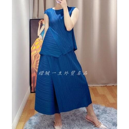 HOT SELLING The new fold short sleeve loose T-shirt + pleated skirt irregular solid two-piece outfit IN STOCK
