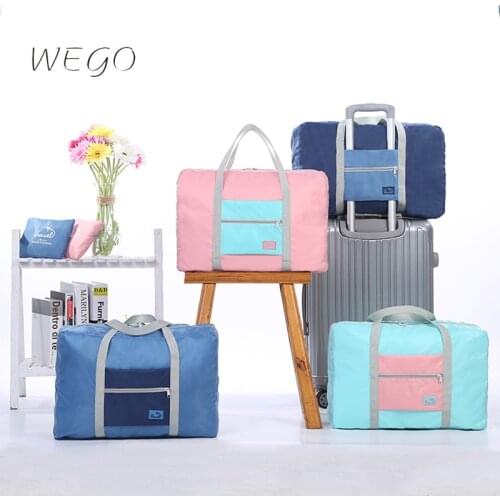 2021 Spot New Korean Portable Travel Bag Dustproof Foldable Waterproof Storage Bag Hit Color Folding Airplane Bag