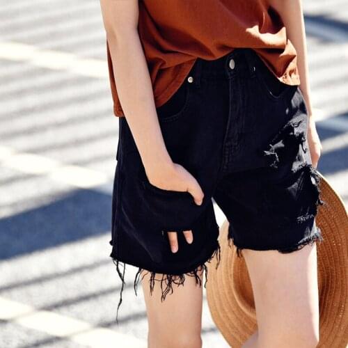 MICOCO N5905C Korean version of fashion wash to make old rough edge false holes loose straight jeans shorts