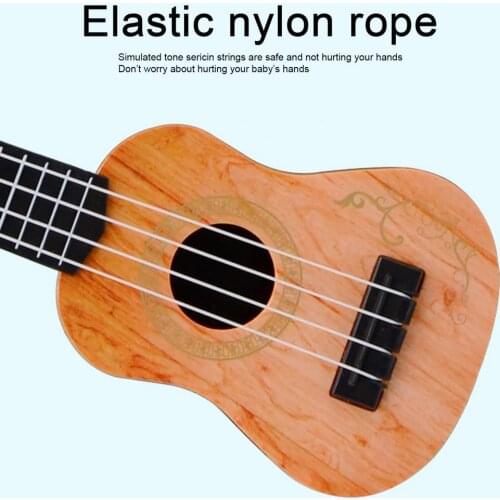 Guitar Toy Simulation Music Enlightenment Elastic Baby Classical Ukulele Toy model Mini four-string guitar Instruments
