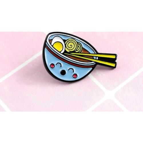 Delicious food in a blue smiley bowl with an egg brooch makes people full of appetite for food friends accessories