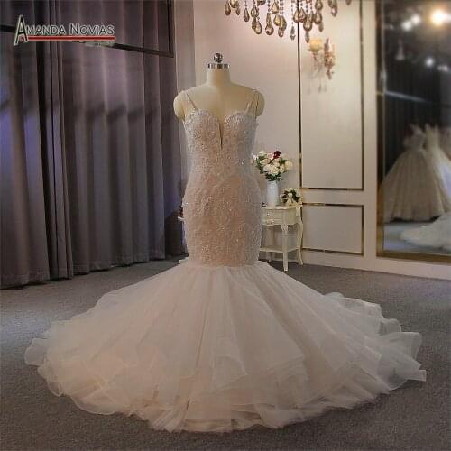 Beading champagne color mermaid wedding dress with ruffles