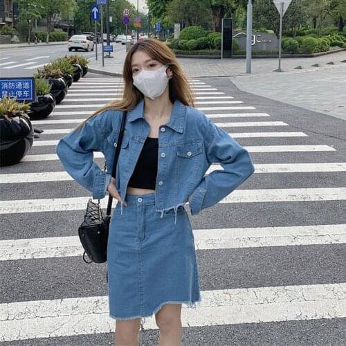 Spot Chinas new fashion short single breasted long sleeve fringed jeans jacket + high waist irregular jeans skirt two sets
